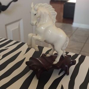 Ivory carved Horse in stand